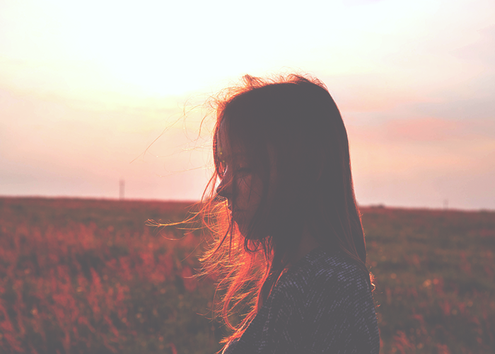 girl-standing-in-field