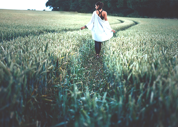 tfd_photo_woman-walking-in-field