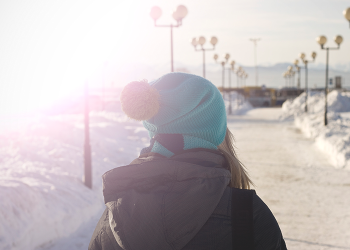 tfd_photo_woman-walking-in-snow-blue-hat