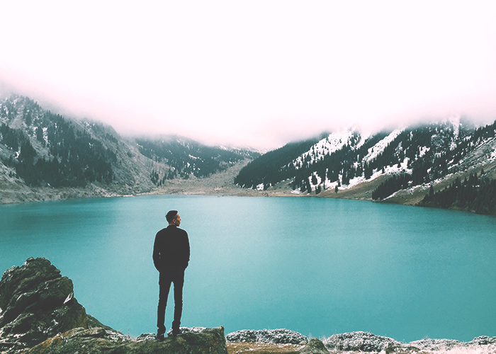 man-standing-near-lake