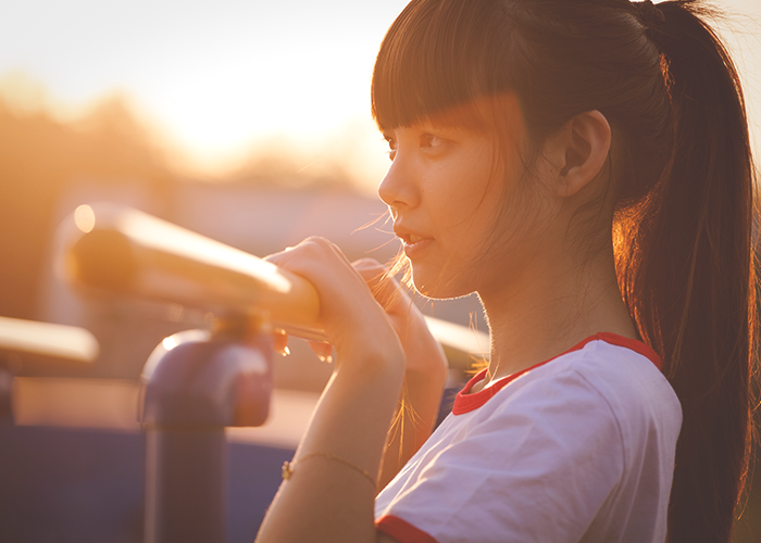 tfd_asian-woman-looking-out-in-sun