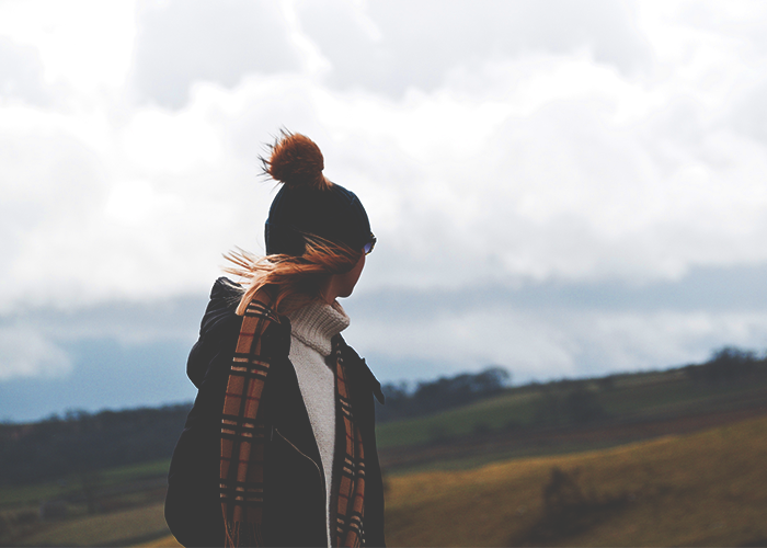 tfd_woman-wearing-cozy-hat-in-field