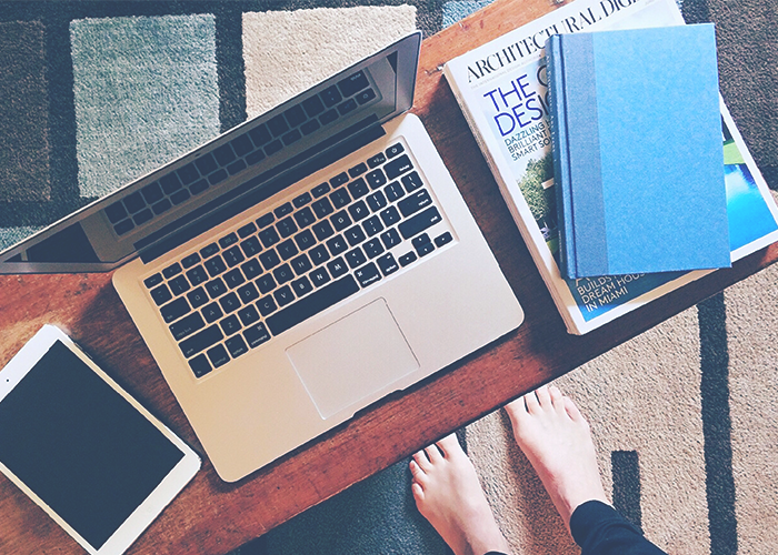 tfd_photo_woman-coffee-table-standing-over-books