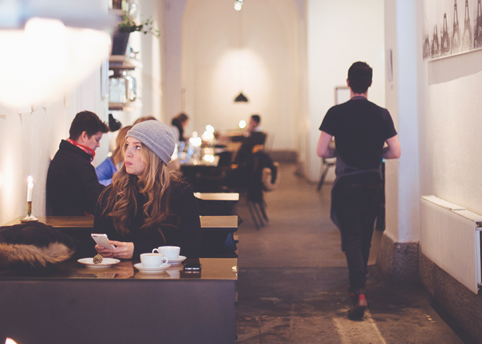 tfd_woman-sitting-in-cafe-alone-in-hat