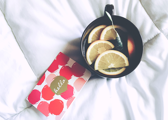tea-and-card-on-bed