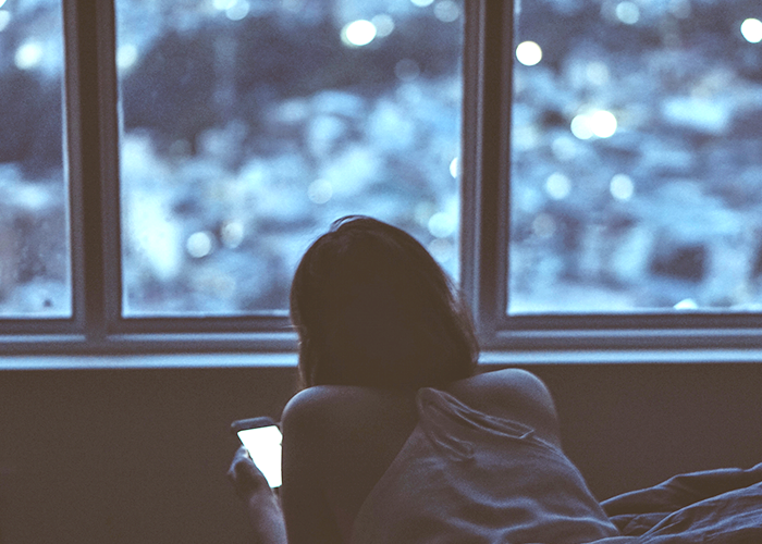 tfd_girl-in-dark-room-on-phone