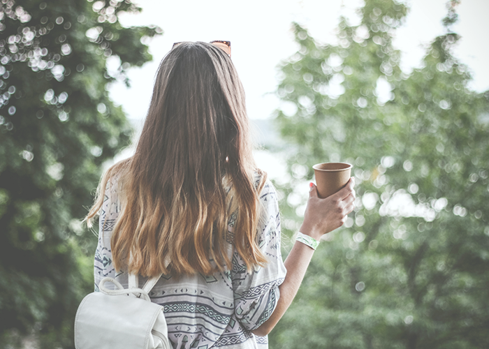 tfd_woman-standing-with-coffee-cup