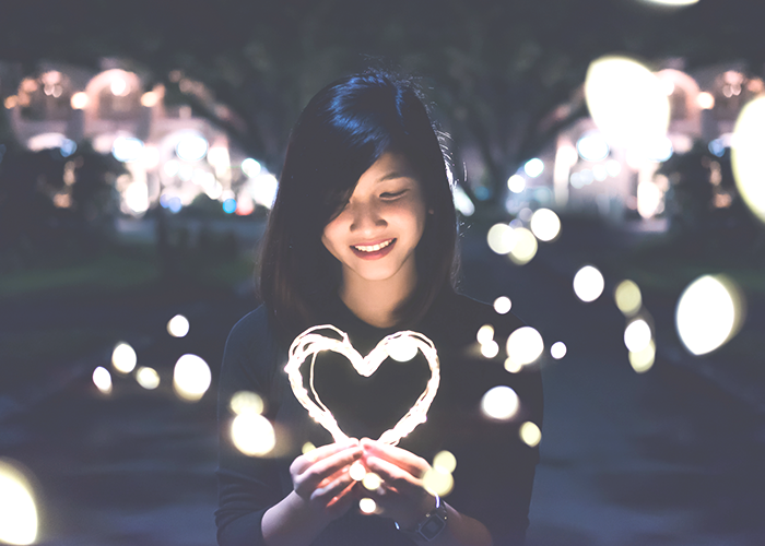 woman-holding-a-light-heart