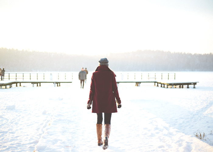 woman-walking-in-snow-outside