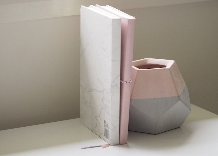 https://s14354.pcdn.co/wp-content/uploads/2020/02/white-and-pink-books-piled-beside-pink-and-gray-ceramic-vase-749569.jpg