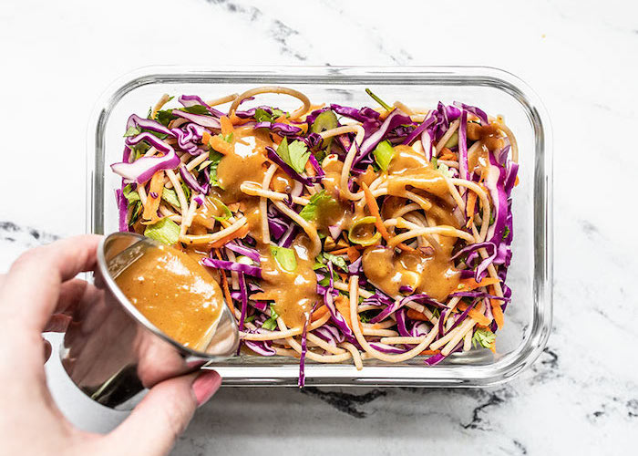 https://s14354.pcdn.co/wp-content/uploads/2020/03/Cold-Peanut-Noodle-Salad-Add-Dressing-to-Meal-Prep-1.jpg