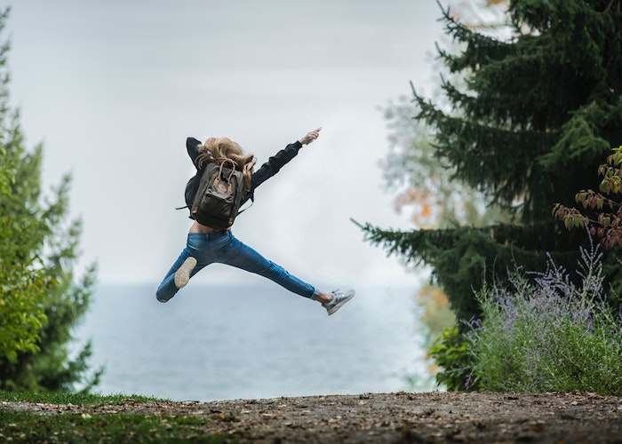 woman-jumping-freely-outside